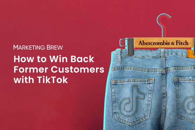 A pair of jeans with the TikTok logo stitched into the back pockets, being held up by an Abercrombie & Fitch trouser hanger.