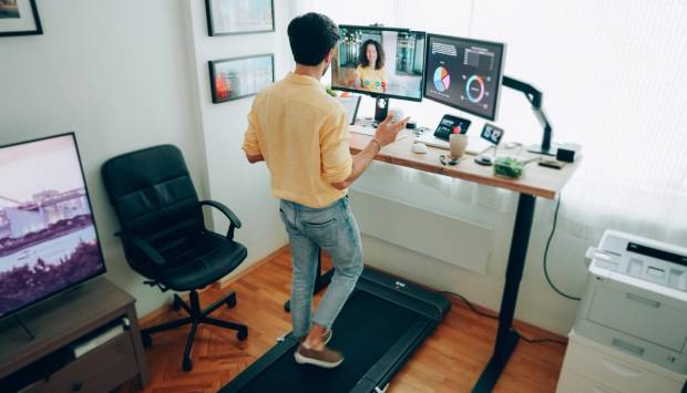 A man using a standing desk