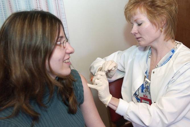 Stephanie S. McDonough gets an injection of Gardasil vaccine, which prevents HPV, from Debra K. Lillington at the Reading Hospital.