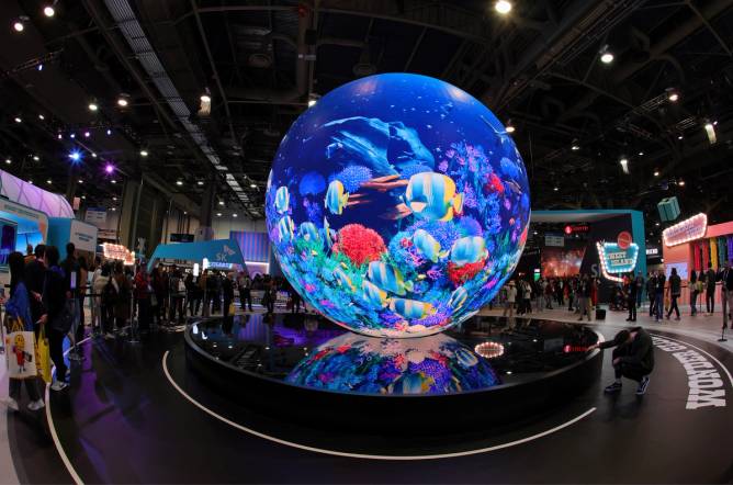 A giant spherical screen displaying an image of colorful fish at the CES trade show in Las Vegas