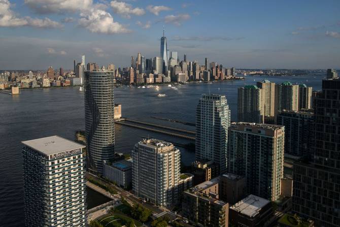 An aerial general view shows the New York city skyline from New Jersey on August 5, 2021