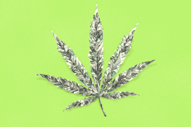 An origami cannibas leaf created from dollar bills. photo illustration.