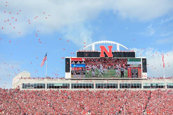 Red balloon release at Memorial Stadium in Nebraska.