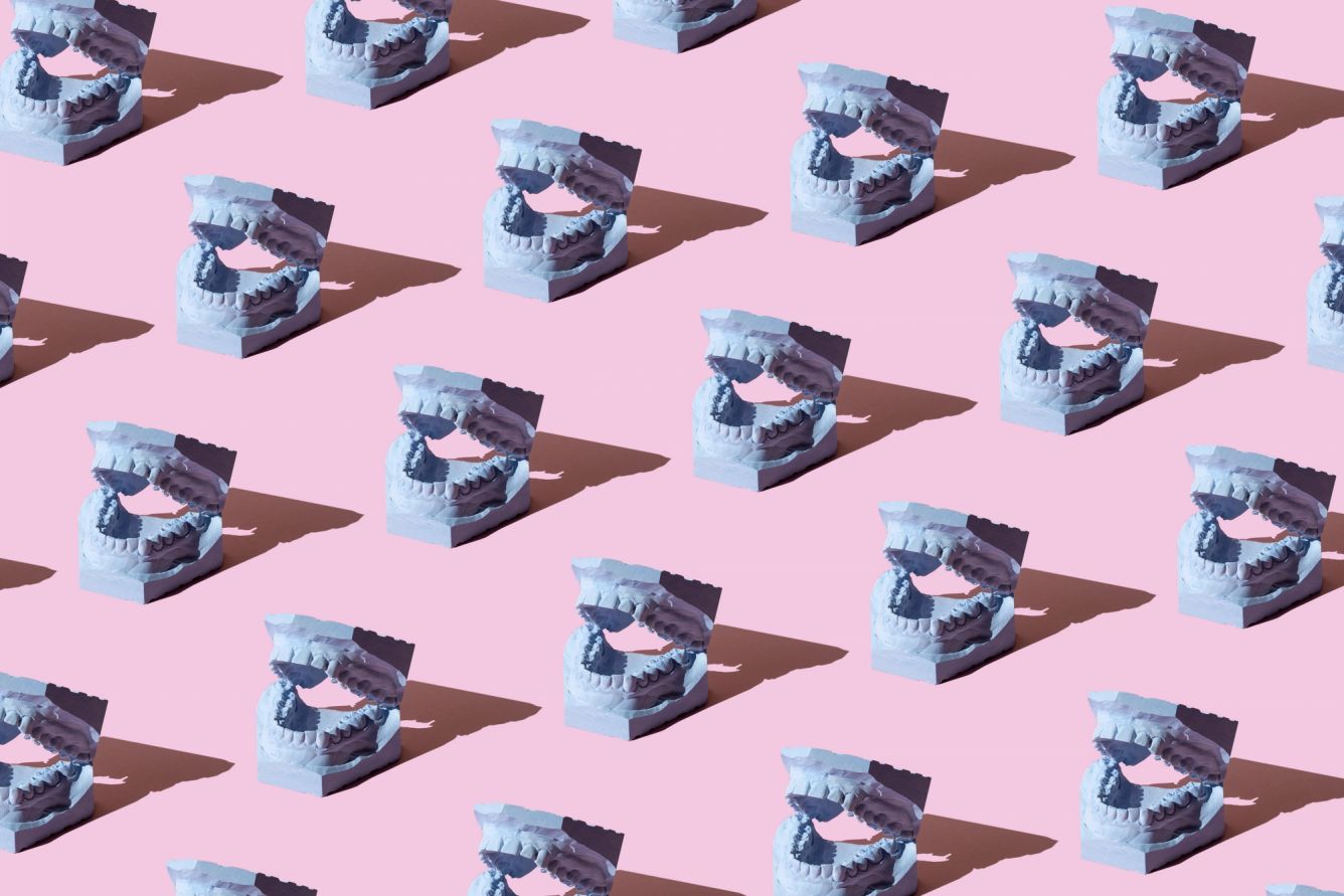 Repeated dental model on the pink background