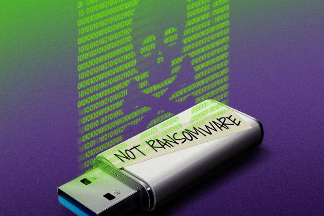 A USB drive with "not ransonware" written on masking tape with binary code floating above it in the form of a skull and crossbones