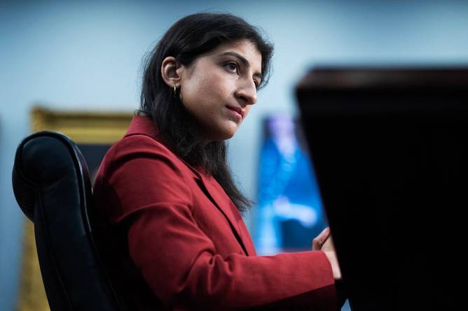 ftc chair lina khan seated at a table