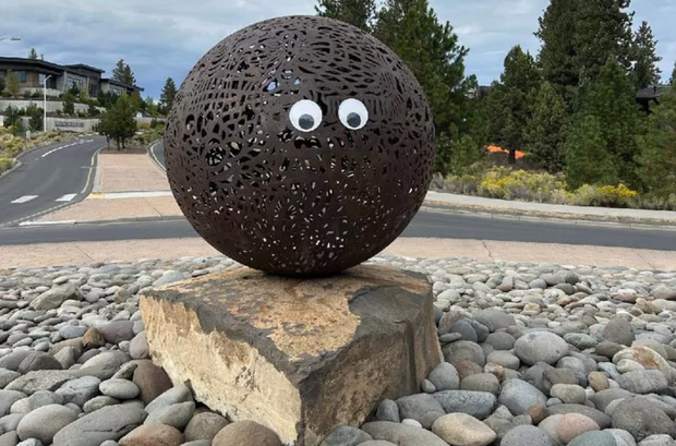 Googly eyes on a public statue in Bend