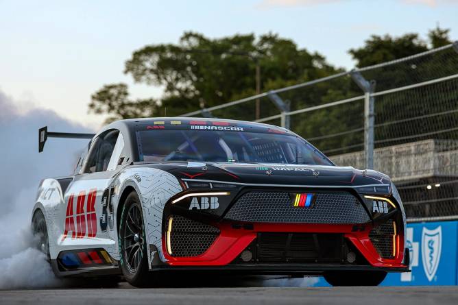 The ABB NASCAR new EV prototype performs a demonstration run on track at the Chicago Street Course.