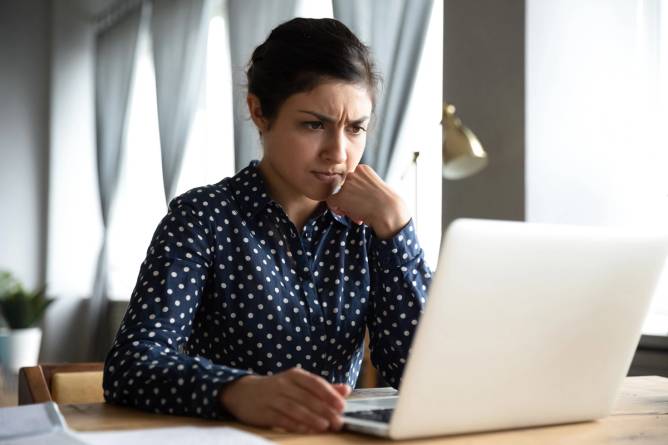 woman looking at computer