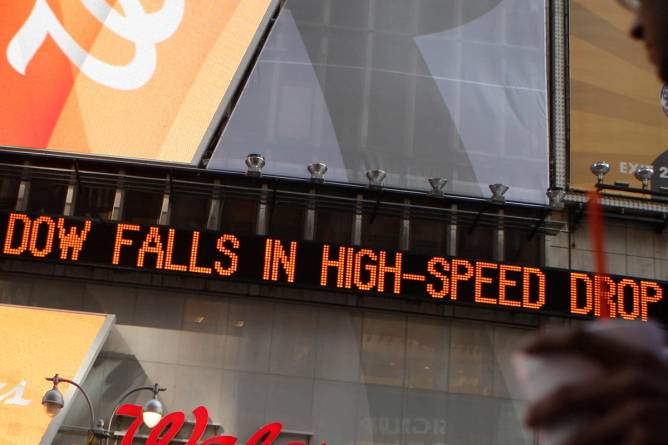 Financial news of todays turbulent stock market is displayed on a news ticker in Times Square May 6, 2010 in New York City. The Dow Jones industrials plunged nearly 1,000 points before ending the day down at 347.