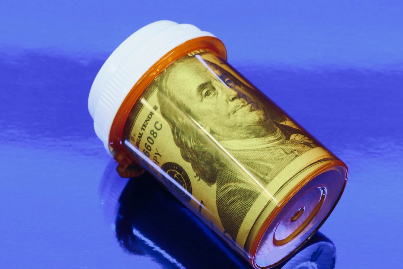 Dollar wrapped inside a pill bottle.