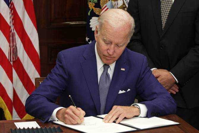 President Biden signing an executive order on abortion