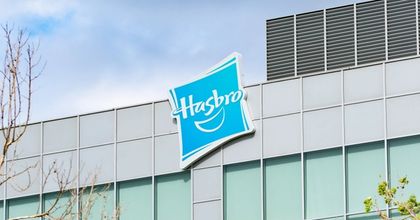 Closeup of a Hasbro sign hanging on the top of a corporate building