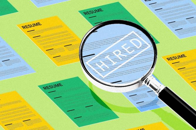 Magnifying glass hovering over a resume