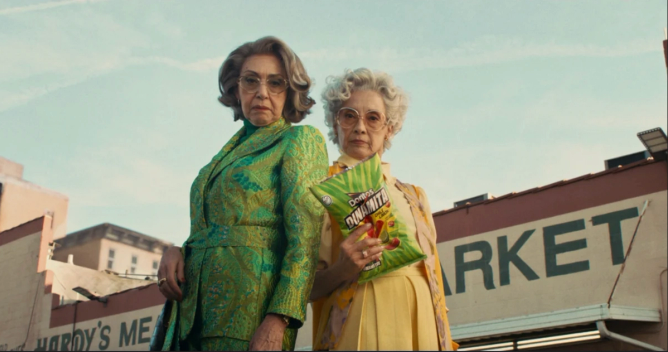 an image from Doritos' Super Bowl 2024 ad featuring two grandmas holding a bag of Doritos Dinamita chips