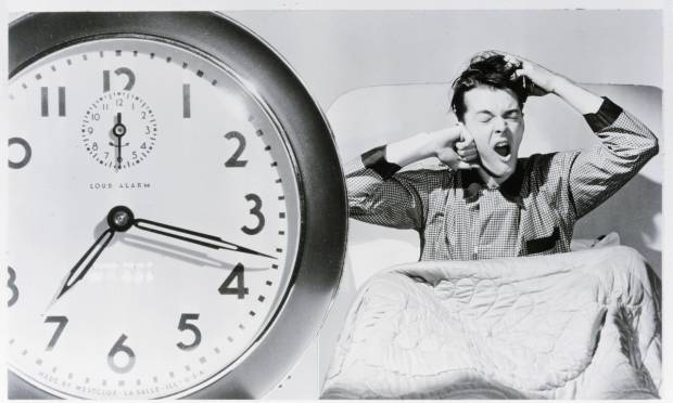 old photograph of man waking up