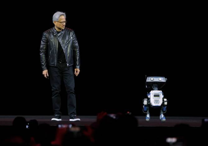 Nvidia CEO Jensen Huang with a robot. 