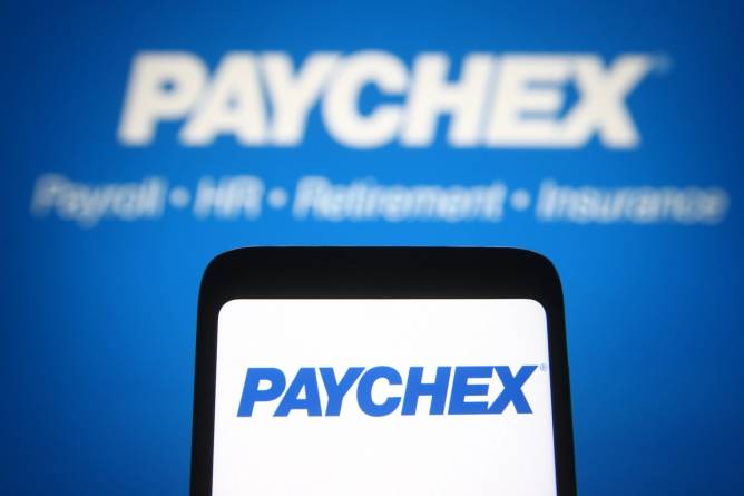 image of paychex logo on cellphone in front of backdrop that says paychex