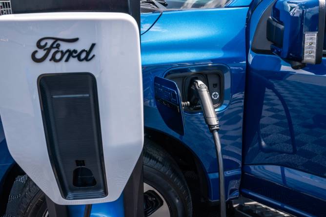 A Ford EV plugged into a charger.