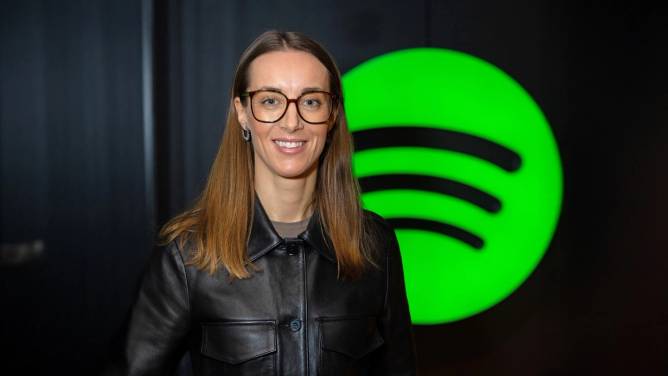 Spotify CHRO Anna Lundström stands in front of the streaming platform's logo