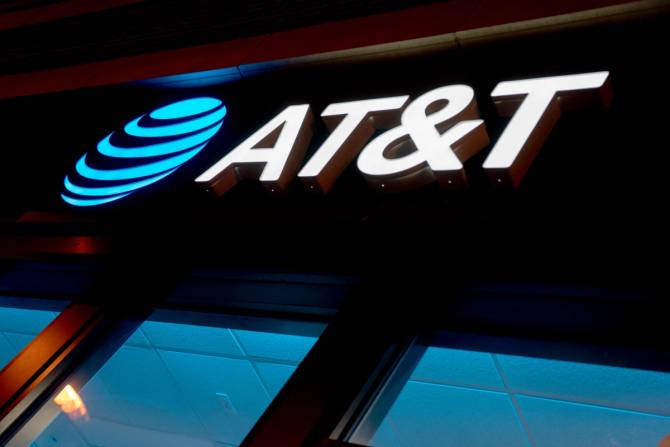 Close-up of the blue AT&T logo on a storefront.
