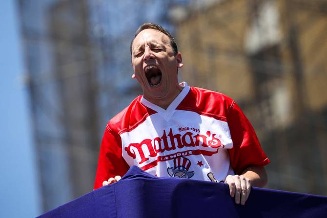 Joey Chestnut screaming after winning the hot dog eating contest