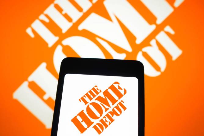 The Home Depot logo on a phone screen. 
