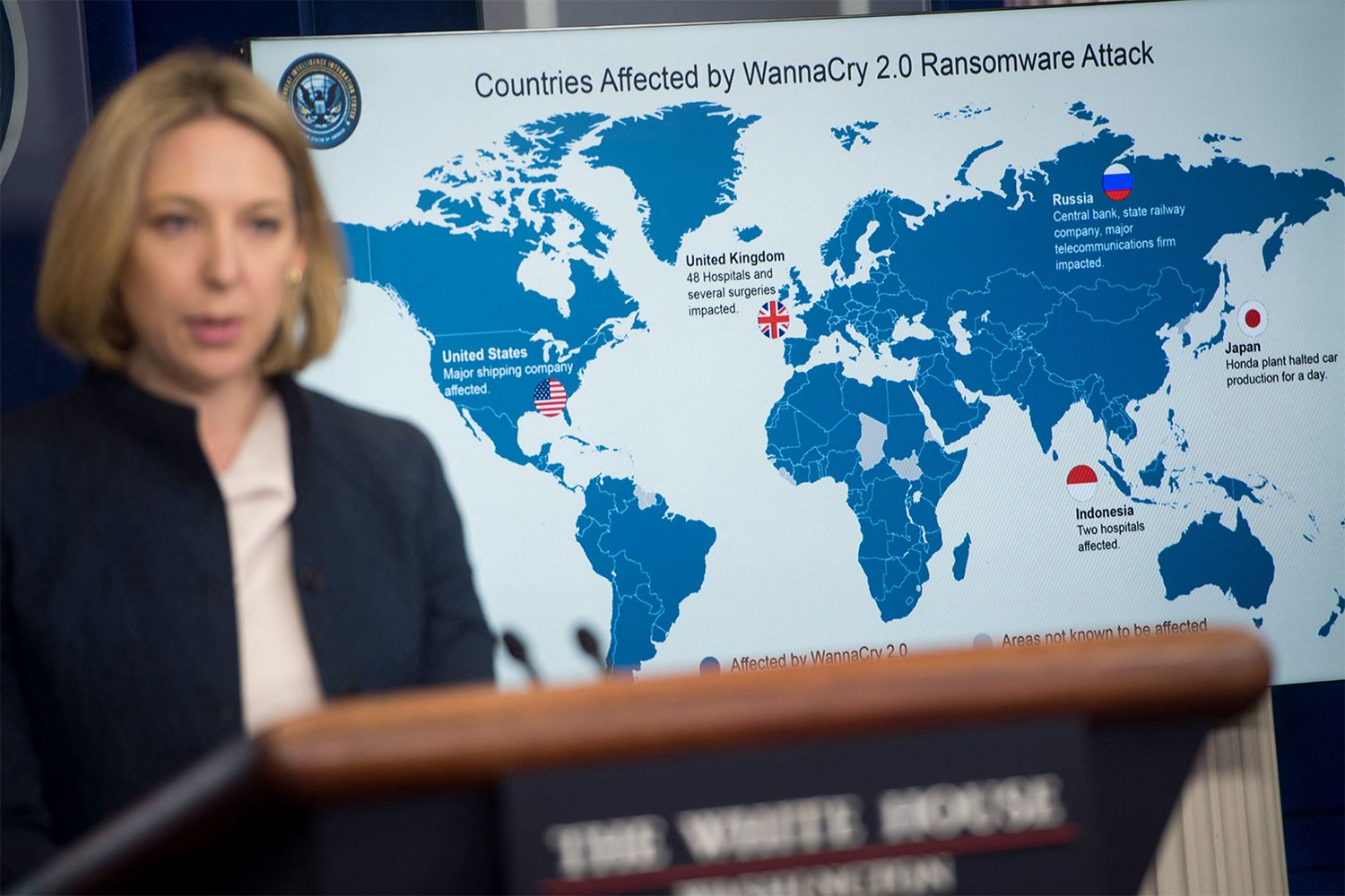 Jeanette Manfra, chief cybersecurity official for the Department of Homeland Security (DHS), stands in front of a world map of countries hit by Wannacry ransomware.