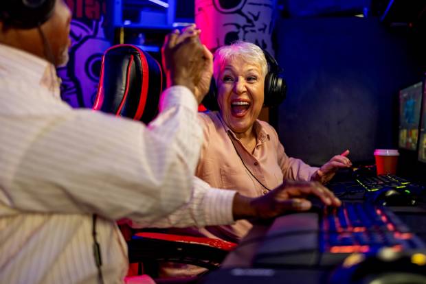 Older gamer celebrates a win