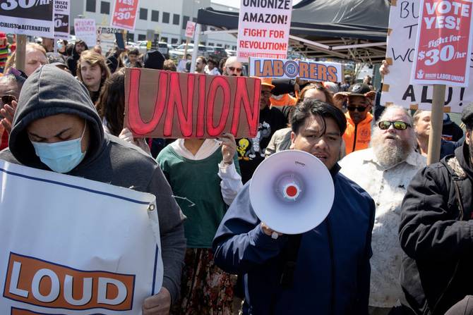 Supporters of Amazon workers attempting to win a second union election at the LDJ5 Amazon Sort Center join a rally in support of the union