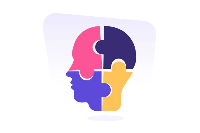Puzzle pieces forming the profile of a person's head.