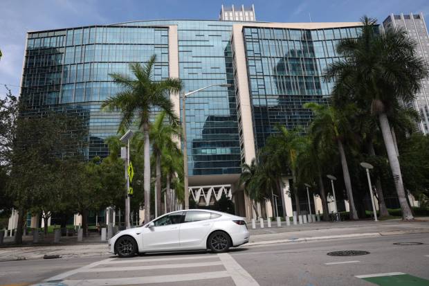 A Tesla vehicle passes the Wilkie D. Ferguson Jr. U.S. Courthouse in Miami