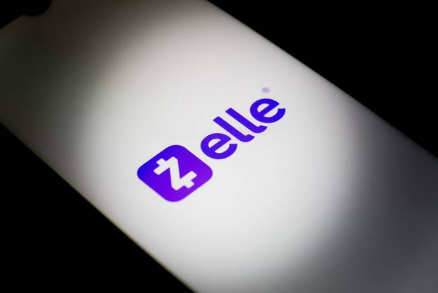 The Zelle logo is being displayed on a smartphone screen