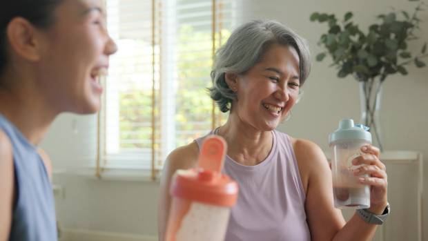 Two women drinking shakes