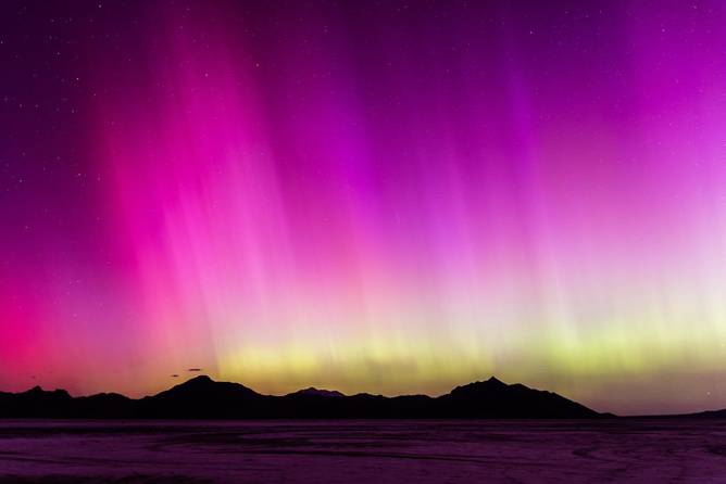 A geomagnetic storm lights up the night sky above the Bonneville Salt Flats on May 10, 2024 in Wendover, Utah