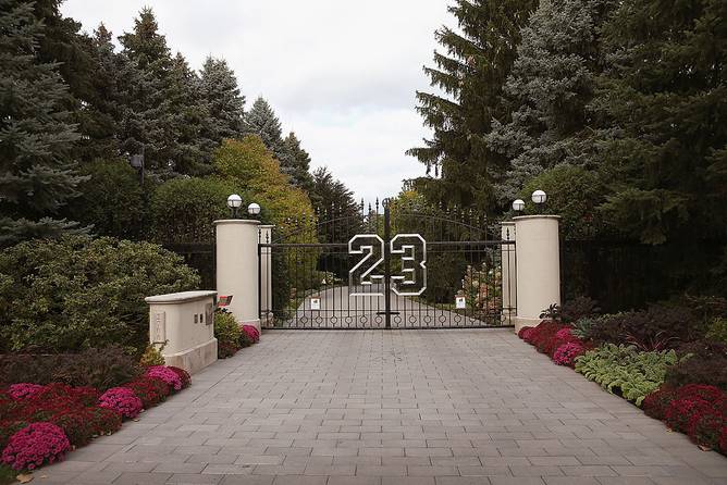 A gate with the number 23 controls access to the home of basketball legend Michael Jordan on October 21, 2013 in Highland Park, Illinois