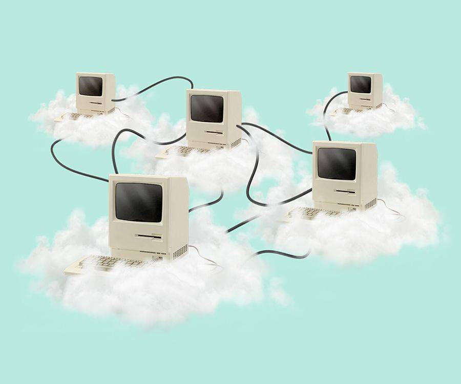 computers sitting on top of clouds, attached by wires