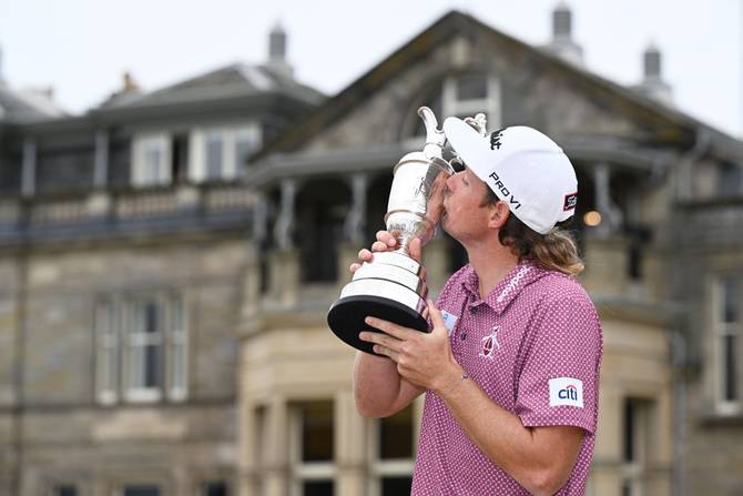 Cameron Smith of Australia poses with The Claret Jug in celebration of victory on the eighteenth green during Day Four of The 150th Open at St Andrews Old Course