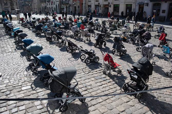 109 empty strollers are placed outside the Lviv city council during an action to highlight the number of children killed in the ongoing Russian invasion of Ukraine
