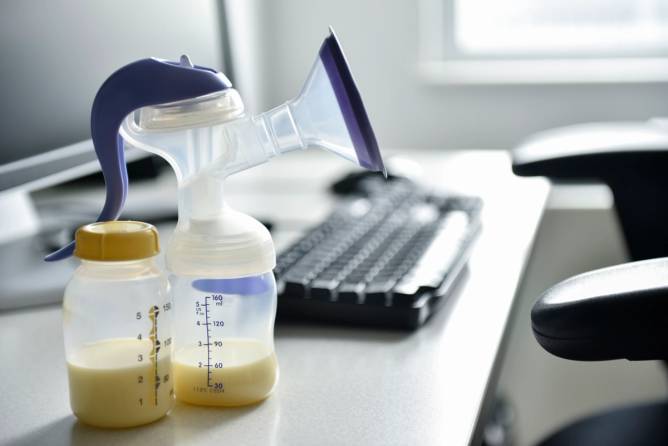 Breast pump next to a computer