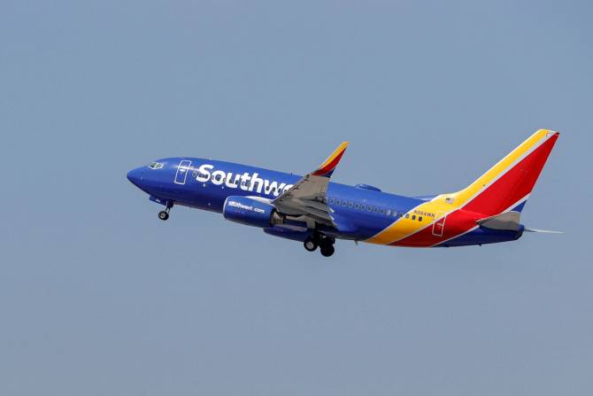 A Southwest Airlines Boeing 737-73V jet departs Midway International Air...