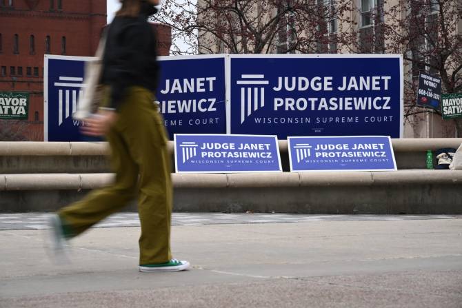 a sign for judge Janet Protasiewicz campaign on the street