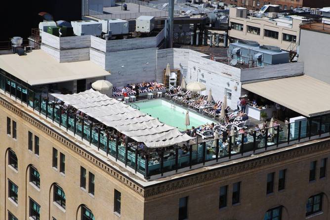 An aerial view of the rooftop pool of the Soho House in New York