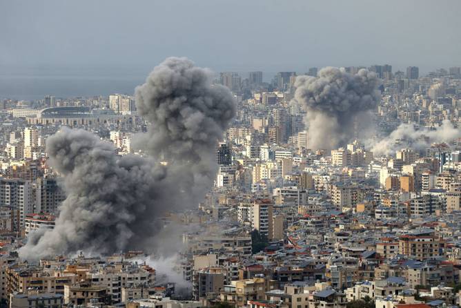 Smoke rises from the site of Israeli airstrikes that targeted Beirut's southern suburbs on November 25, 2024