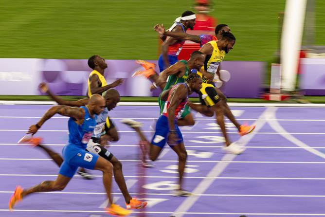 Noah Lyles of Team United States crosses the finish line during the Men's 100m Final