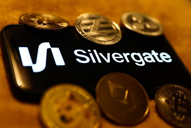 The Silvergate logo surrounded by coins