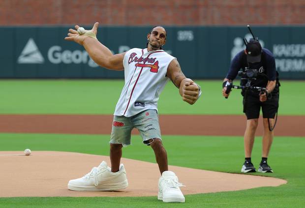 Rapper Ludacris throws out the first pitch prior to the game between the Atlanta Braves and the Colorado Rockies at Truist Park