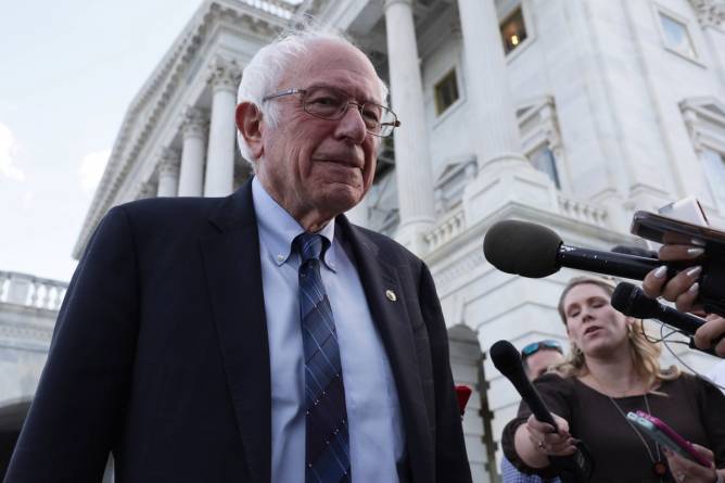 Sen. Bernie Sanders is surrounded by journalists in Washington, DC.