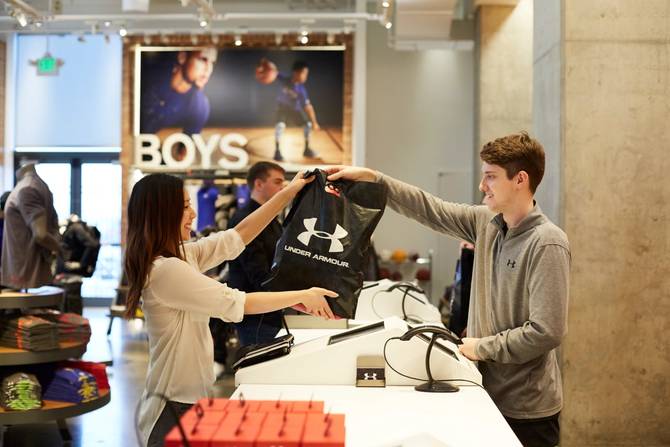A customer shops at an Under Armour store