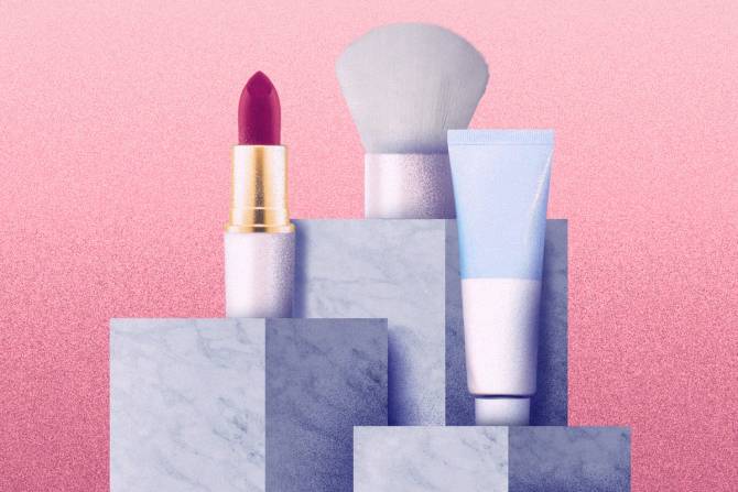 Lip balm, lipstick, and a brush on marble columns
